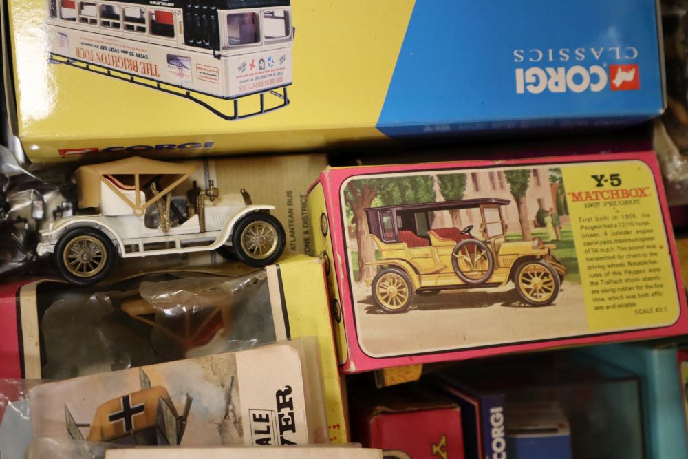A collection of sixteen Matchbox die cast buses and other vehicles, many with original boxes
